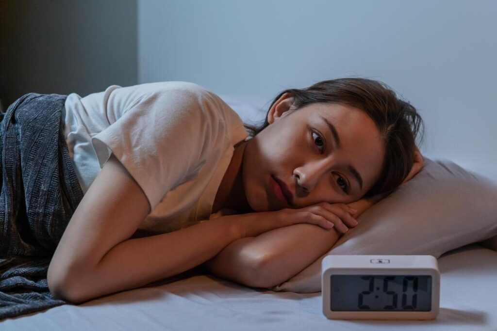 imgi 37 sad worried and stressed asian young beautiful pretty woman girl suffering from insomnia awake in the night in bedr